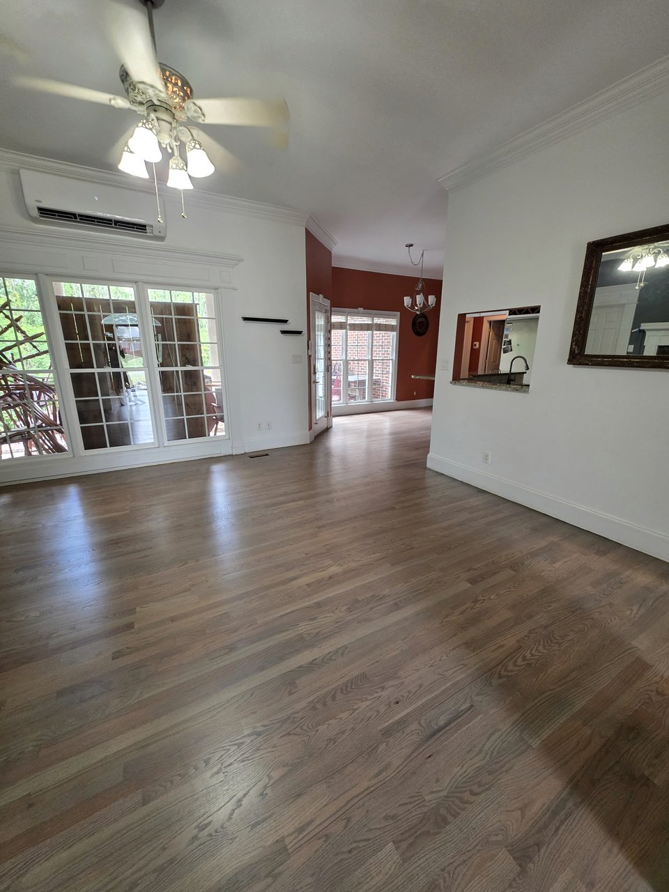 Light finished floor in a sunlit living room