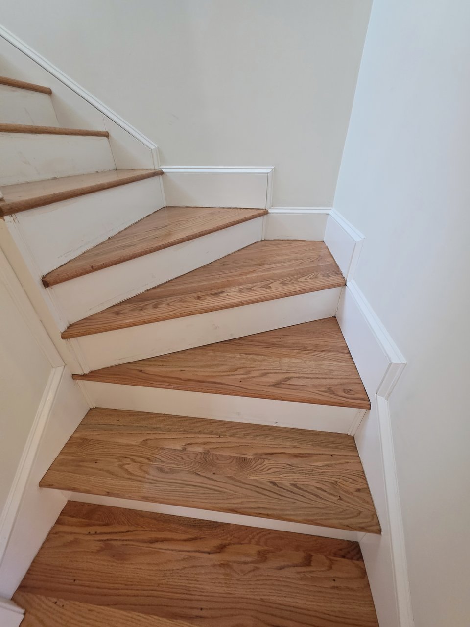 Light wood stair treads viewed from the top landing